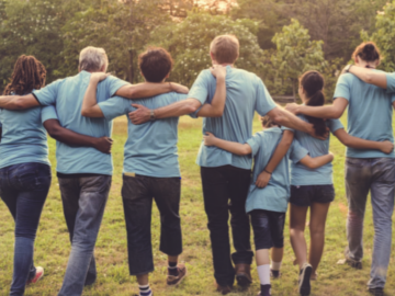 People walking together with hands behind their backs