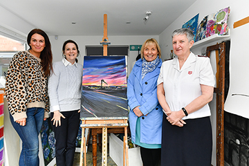 Artist Aly Harte presents Laura Jackson with "Belfast Beauty" following her donation to an appeal which raised more than £2,100 for SVP and The Salvation Army. Joining Aly as she hands over the original are Pauline Brown of SVP and Jacqueline Wright of The Salvation Army.