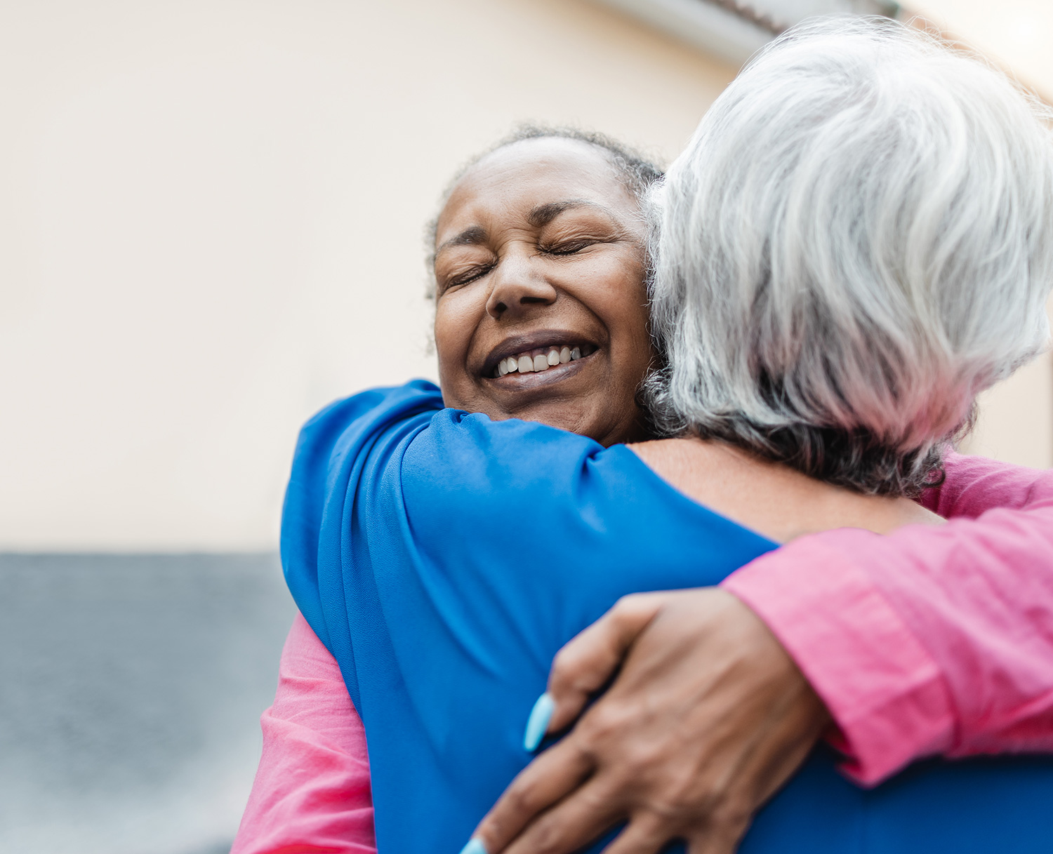 Two old ladies hugging