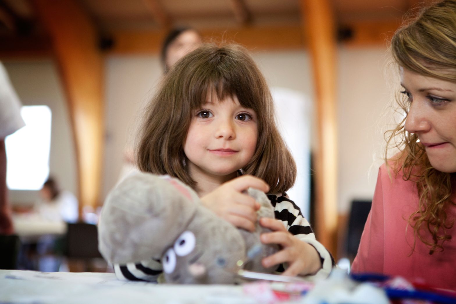 A girl holding her toy